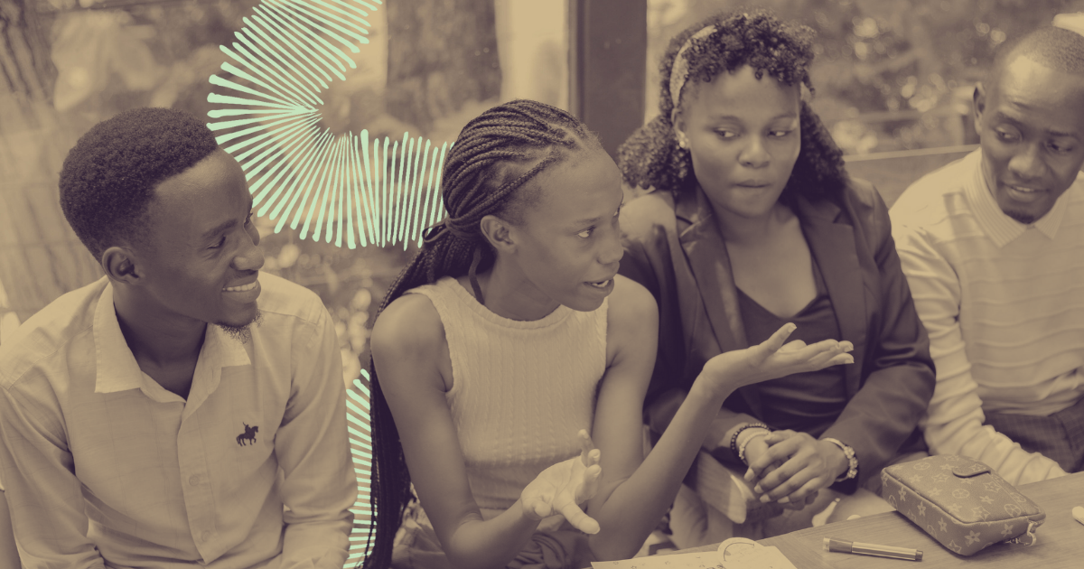 A photograph of people talking at a climate cafe.