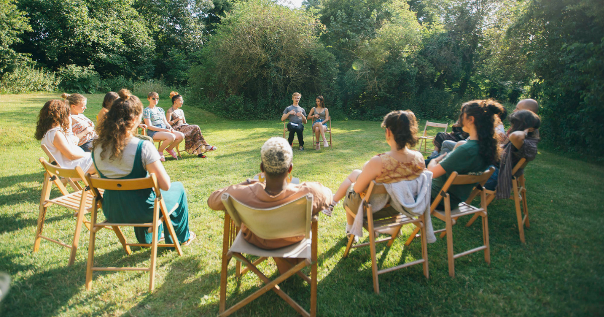 TRP x National Trust: An image of people sat outside in a Resilience Circle